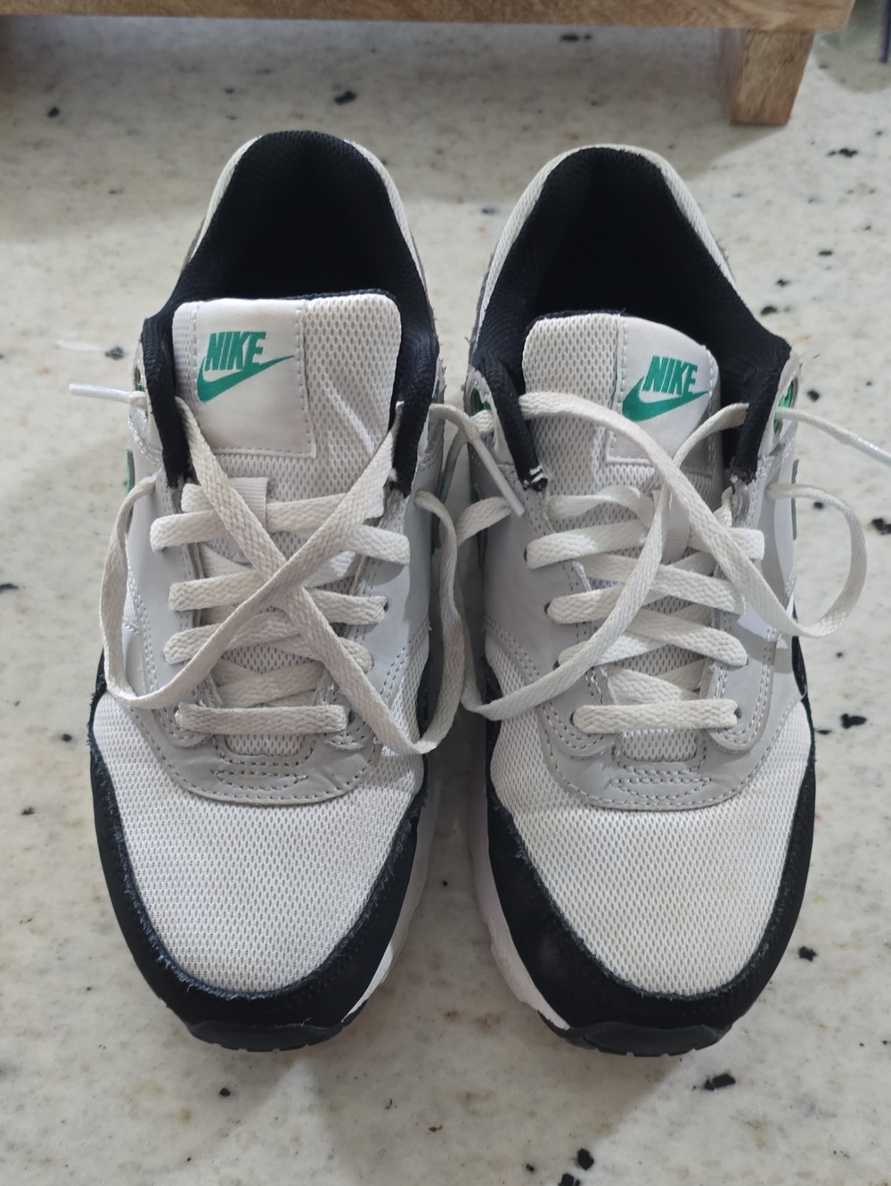 Nike White Sneakers with Black Accents and Teal Logo